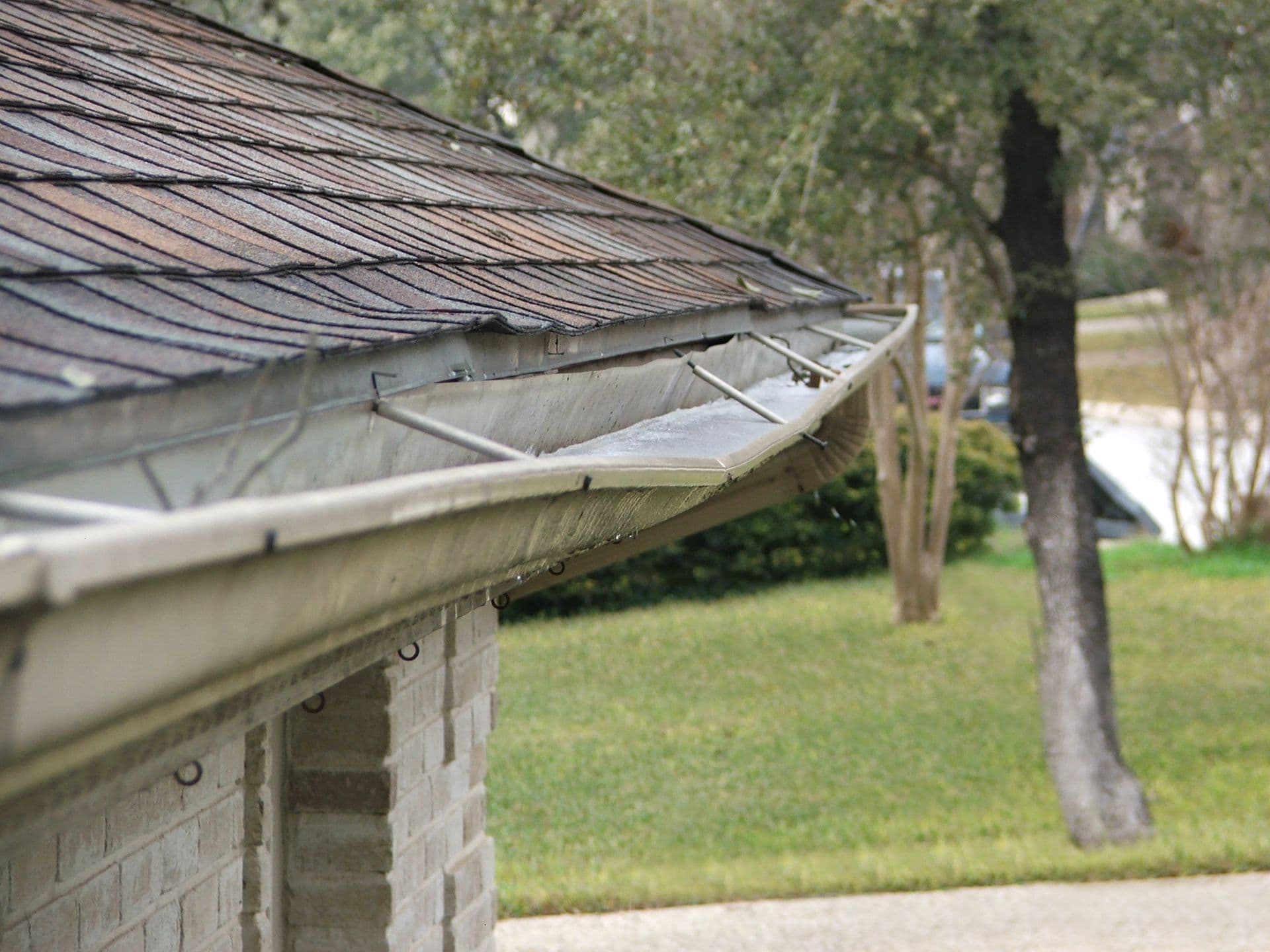 Damaged, sagging gutters.